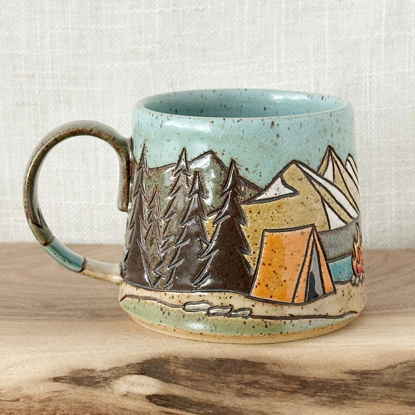orange tent mug - left orientation (12 oz)