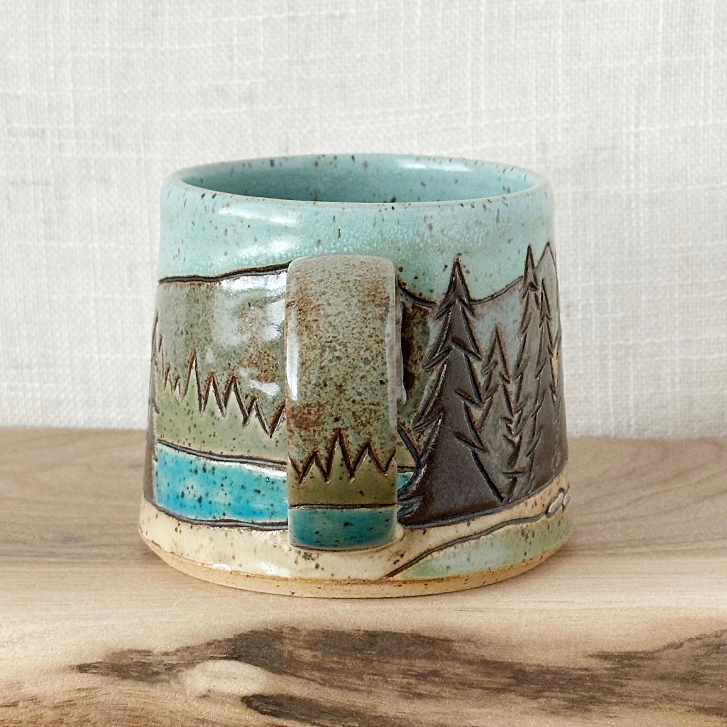 orange tent mug - left orientation (12 oz)