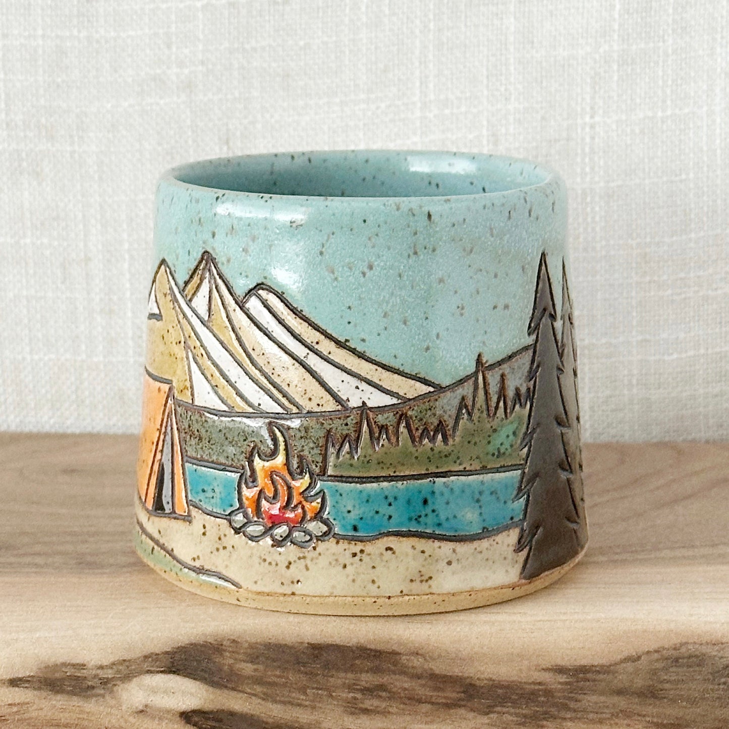orange tent mug - left orientation (12 oz)